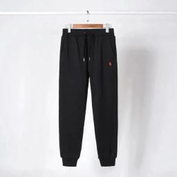 Black pants with red label